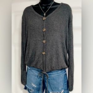 Women’s long sleeve gray top with brown buttons.  Size XL